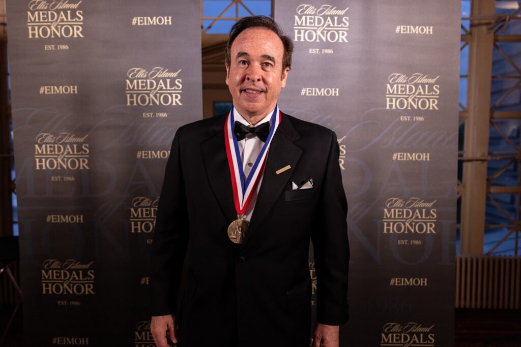 Eric Gertler Wearing Ellis Island Award Medal